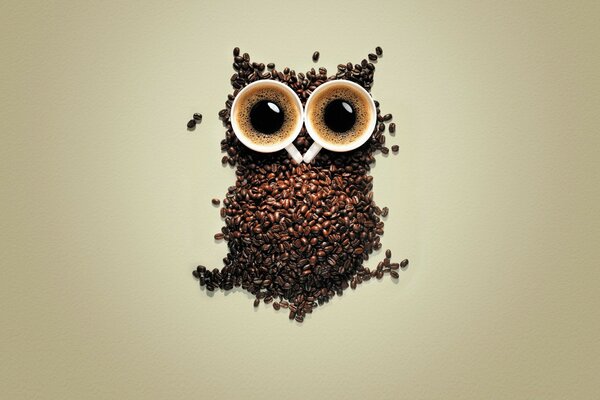 Creative still life. Owl made of coffee beans