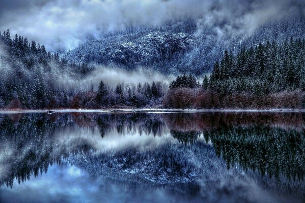 Winter mountains and forest by the river