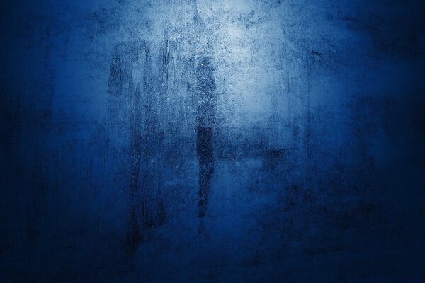 Dark blue wall with light inside