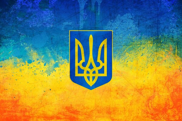 Герб украины на желто-блакитном размазанном фоне