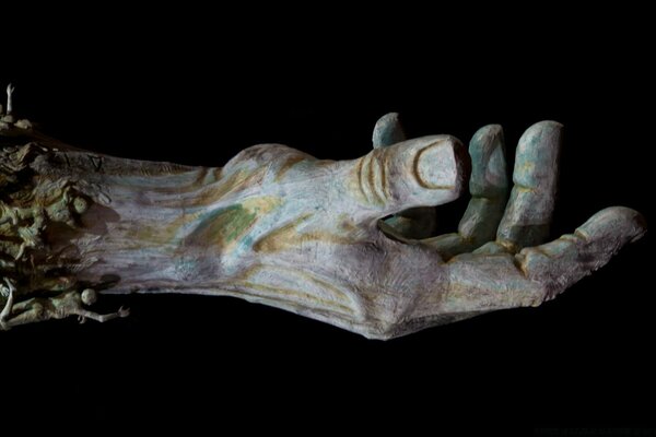 Sculpture of an outstretched hand, palm up