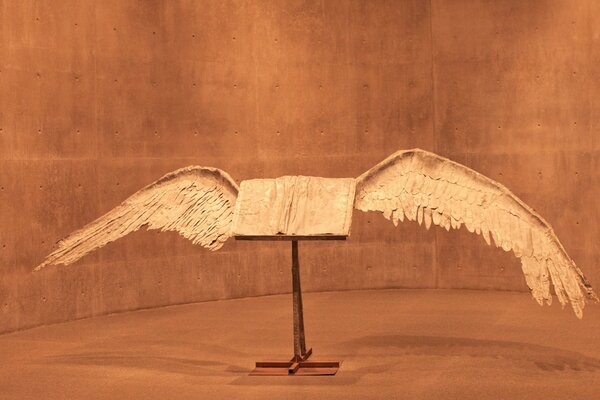 Sculpture white wings on a stand