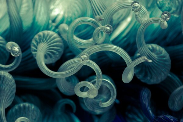 Transparent balls and spirals on a dark background