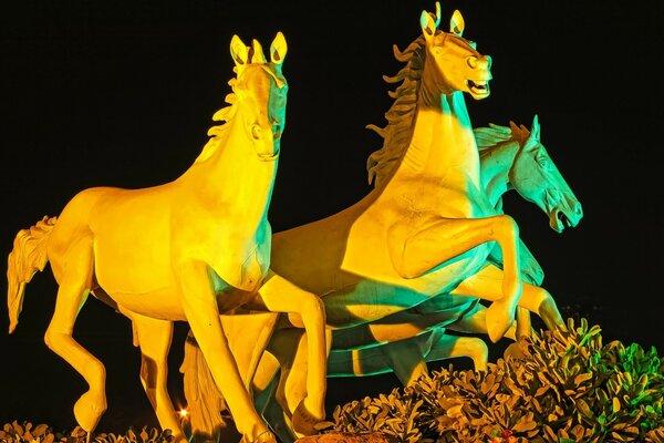 Illuminated sculpture of horses. Art