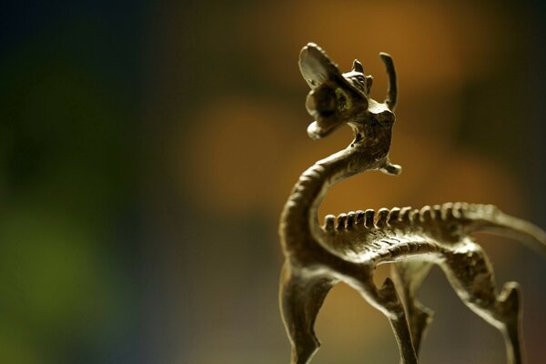 Blurred background. Skk Sculpture of a wild animal