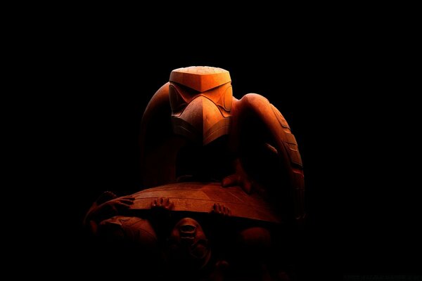 Sculpture of a bird on a black background