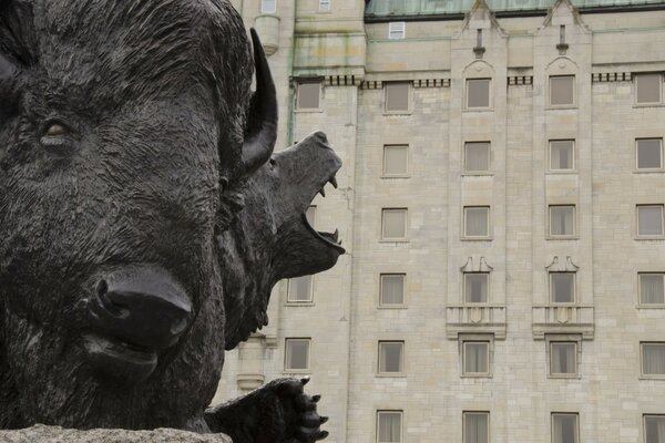 City house on the background of a bull sculpture