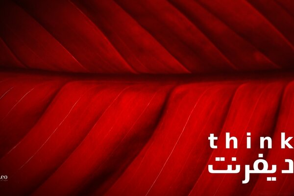 Think and the inscription in Arabic on a red background