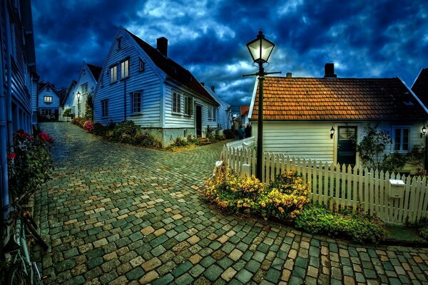 Architecture of the village, night street with a lantern