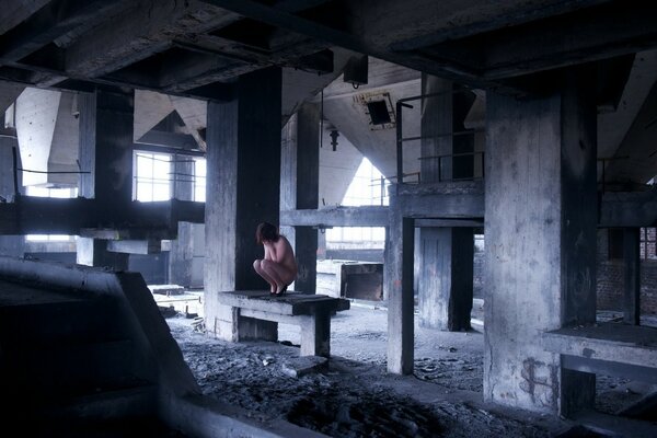 A lonely man in an abandoned room with a dim light