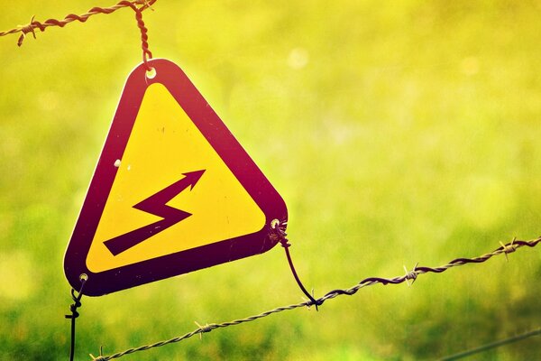 Caution electricity yellow sign