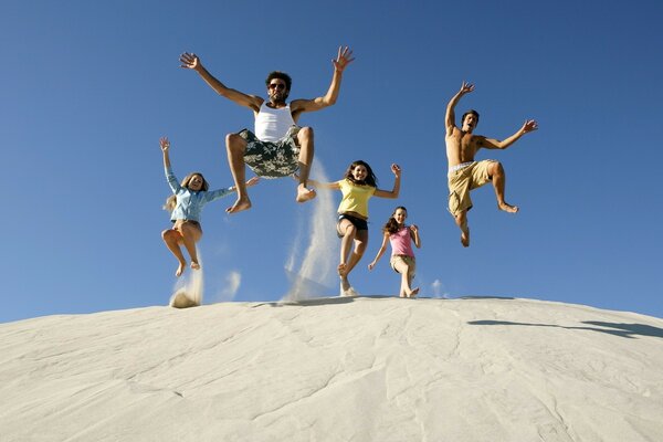 Happy people frozen in a jump