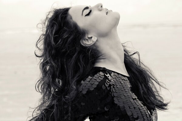 Beautiful girl with lush curly hair