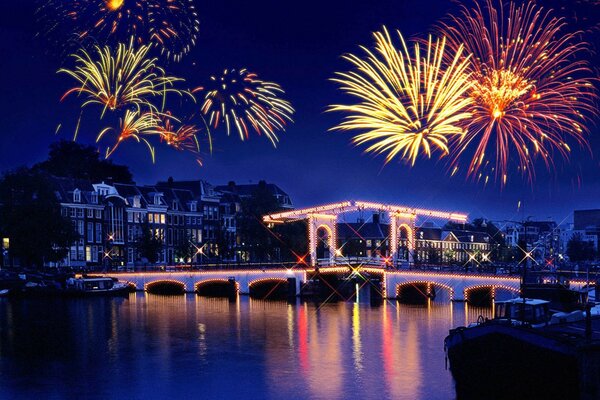 Sparks of fireworks over the roofs of the city