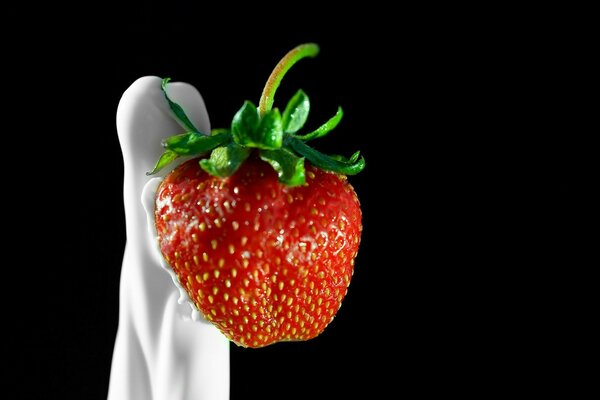 Strawberries in cream HD quality on a dark background