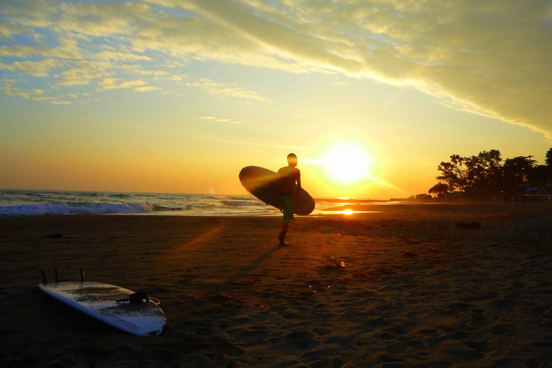 surfing sunset beach water dawn sun evening ocean sea dusk backlit seashore silhouette sand seascape fair weather sky surf landscape travel