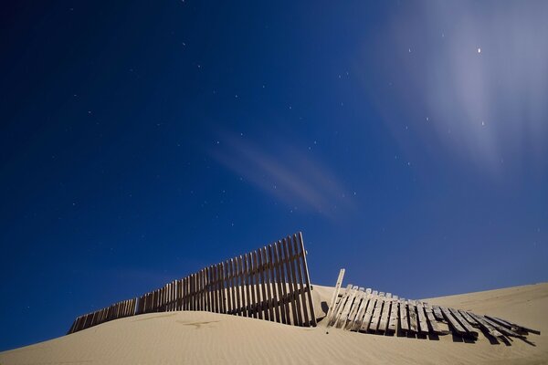 An old fence in the boundless desert