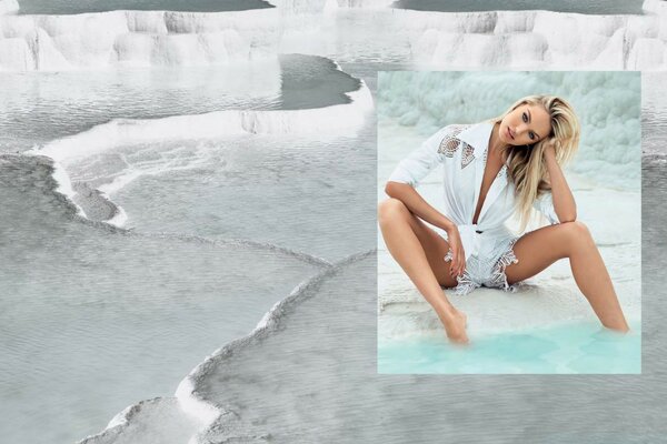 A girl in a white shirt in the water