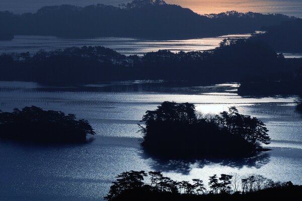 Night landscape with moon over water