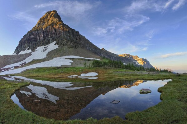 Crystal clear river flowing along the mountain