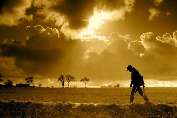 Silhouette of a man walking alone