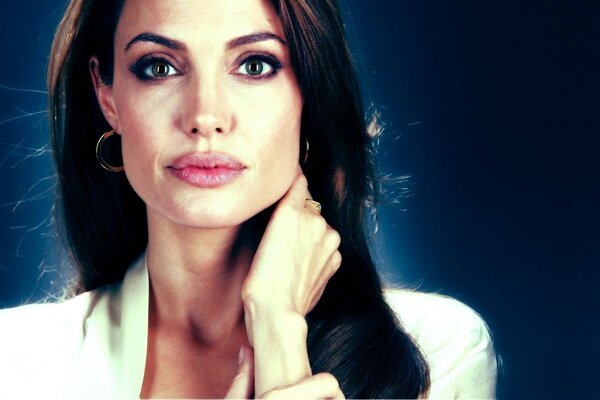 Angelina Jolie on a blue background