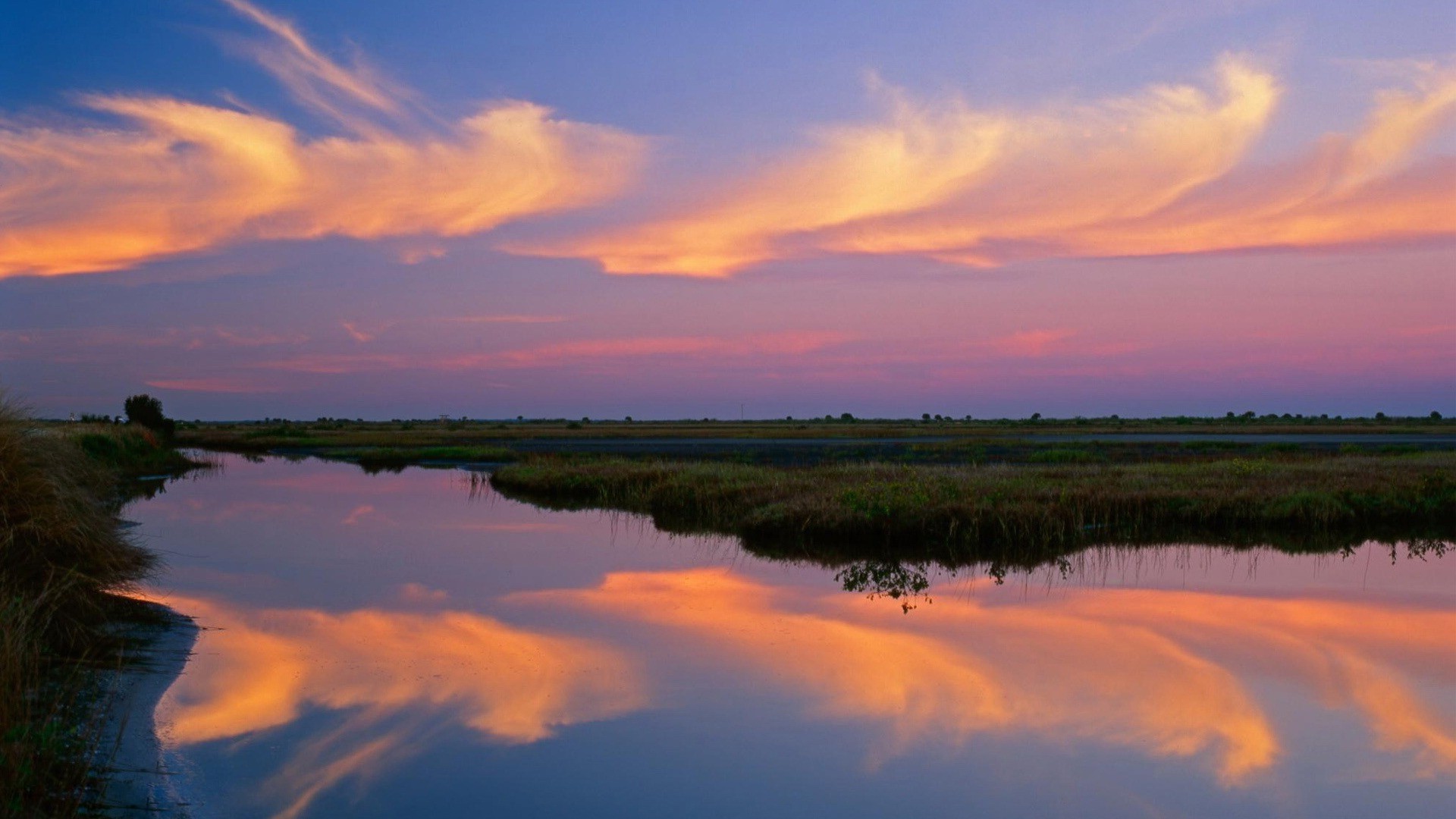 the sunset and sunrise reflection water sunset dawn lake evening nature dusk outdoors landscape sky tree sun