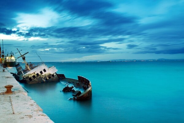 A wrecked ship that sank right next to the pier