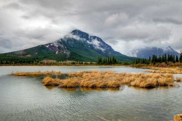 Landscape. Reflection of the mountain in the lake water