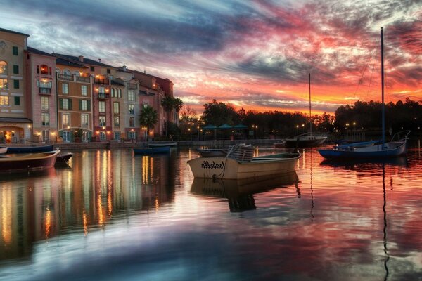 Sunset is reflected in the city pond