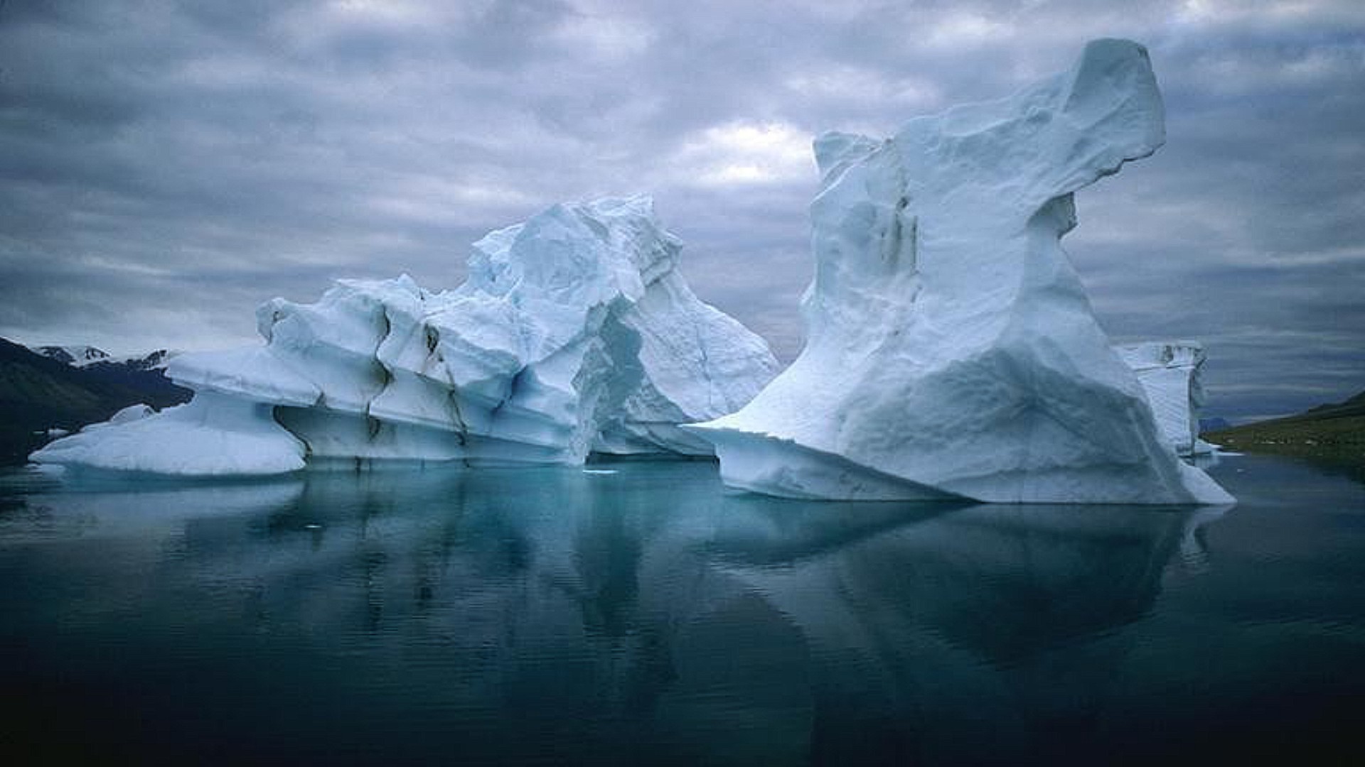 ice iceberg glacier frosty melting water snow frozen cold landscape winter swimming climate change nature reflection ocean antarctic polar travel