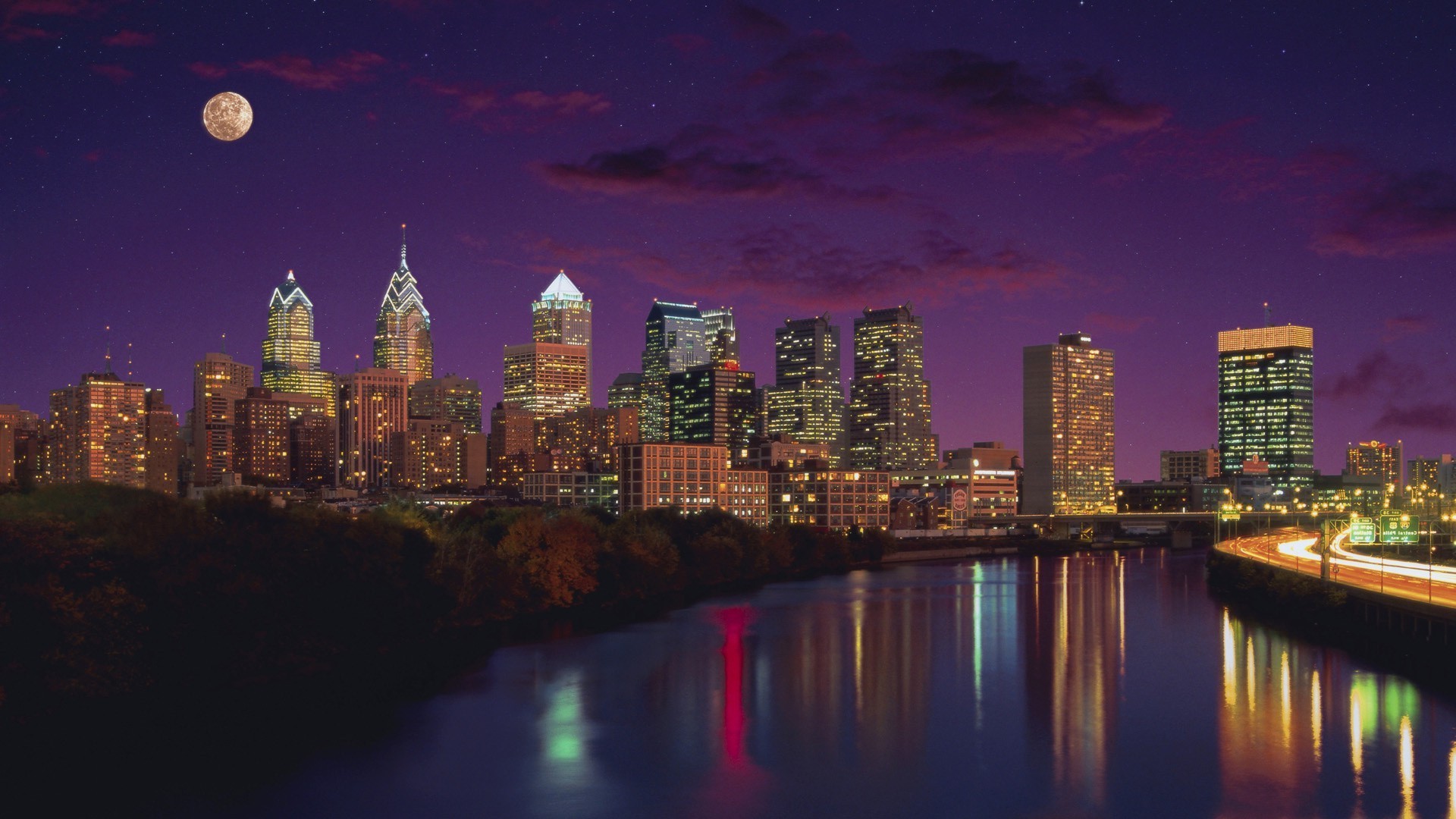 city skyline architecture dusk cityscape river water reflection travel skyscraper downtown building sunset evening sky waterfront illuminated urban bridge