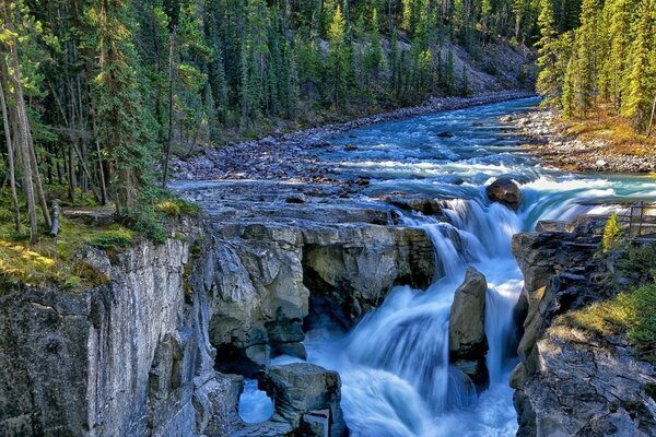 The flow of water through the stones into the river