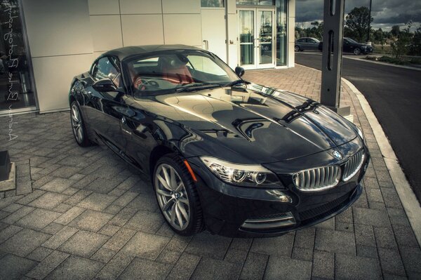 BMW sports car on paving slabs