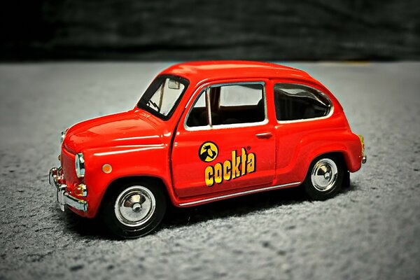 Mini model of a vintage car. A toy