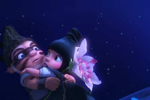 Imagen de la caricatura gnomeo & juliet en el fondo de las estrellas y la Luna