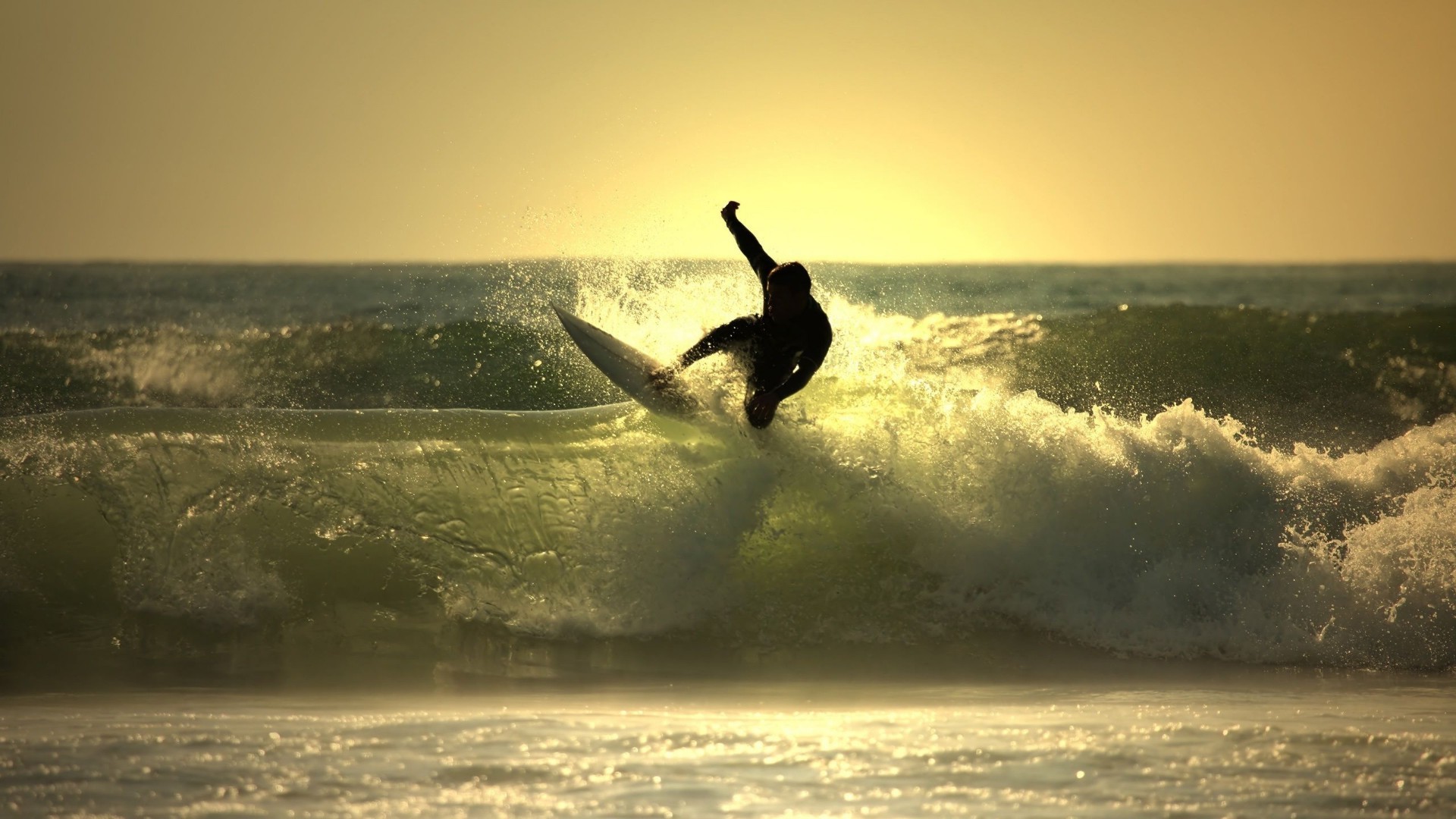 sea and ocean water sunset beach surf ocean sea dawn action sky sun seashore dusk silhouette evening water sports recreation storm backlit