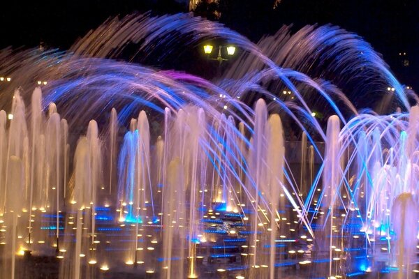 Colored illuminated fountains at night