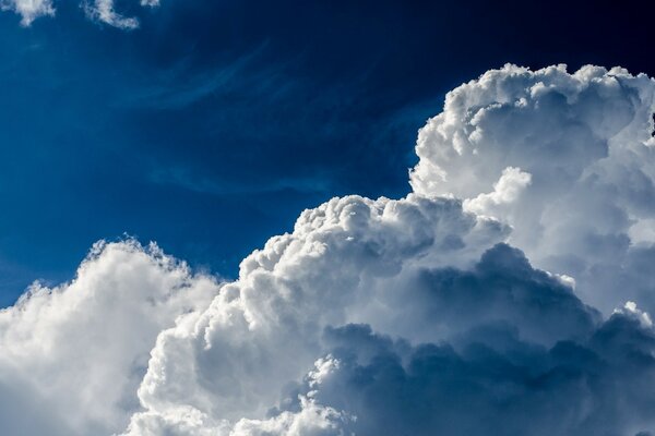 Clouds are gathering over the blue sky