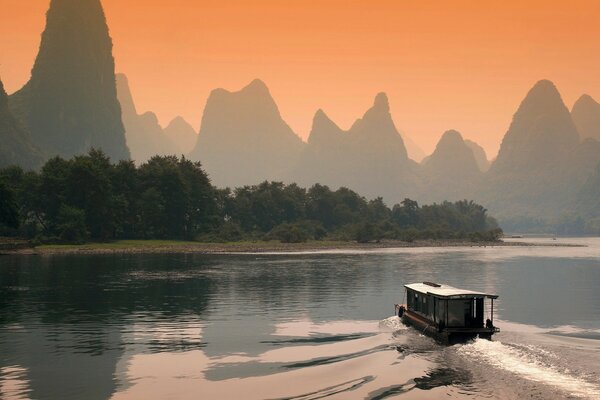 Parahrd in the river against the background of mountains