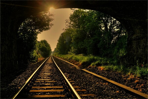 The railway goes into the distance from the tunnel