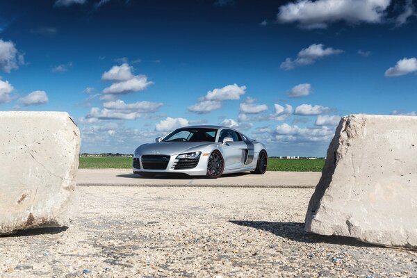 Sports car among concrete blocks