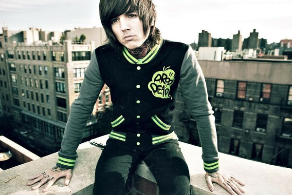 Long-haired brunette guy alone on the roof