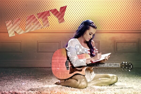 The girl is sitting with a guitar in her hands