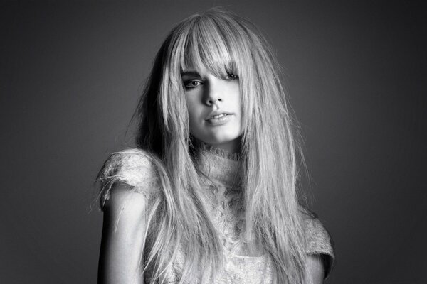 Black and white photo of a blonde with long hair