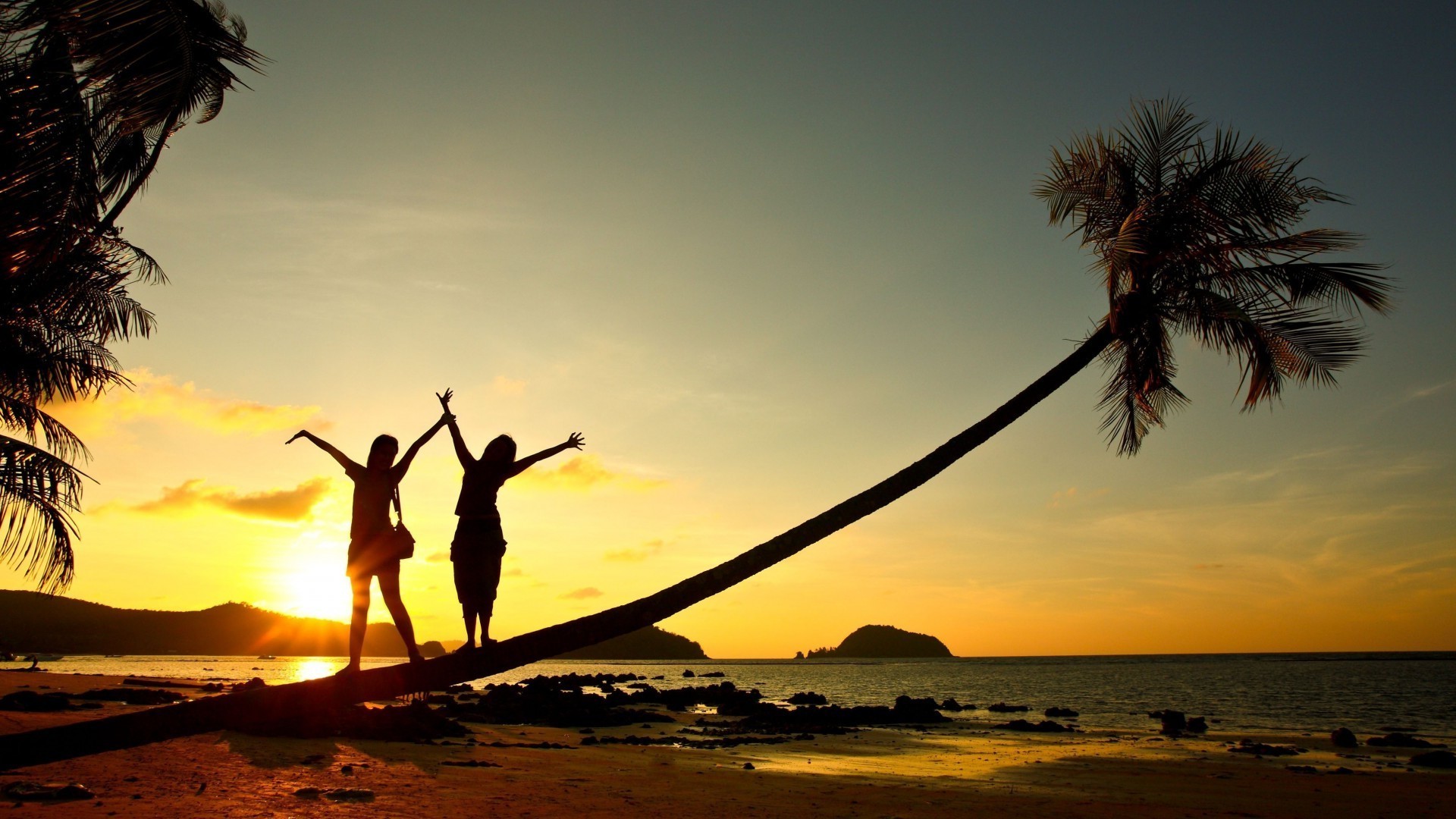 the sunset and sunrise sunset beach ocean sun silhouette water sea dawn backlit evening sky dusk seashore tropical sand travel seascape