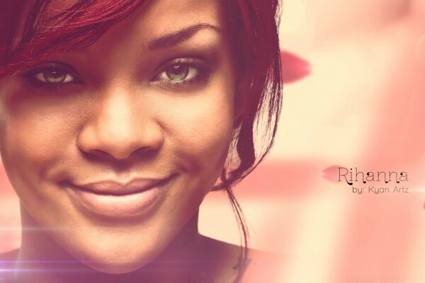 Smiling singer Rihanna on a pink background