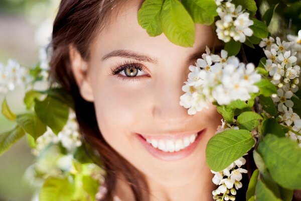 Beautiful smiling girl in foliage