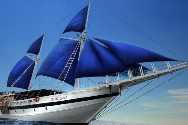 A large yacht with blue sails