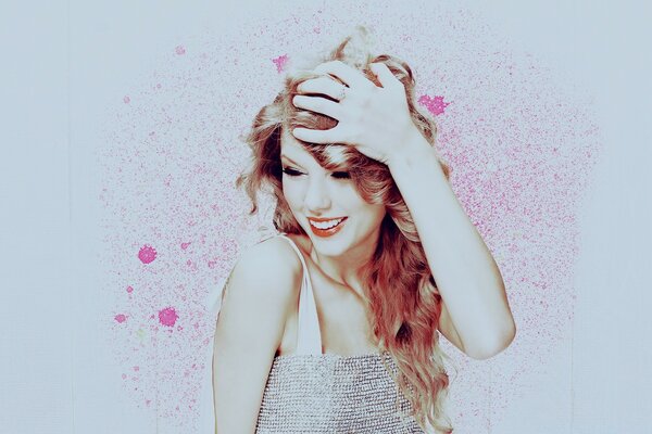 La risa de Taylor Swift en un fondo de salpicaduras de color rosa